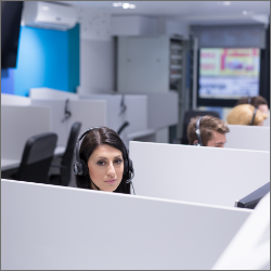 young-smiling-female-call-centre-operator-doing-her-job-with-headset